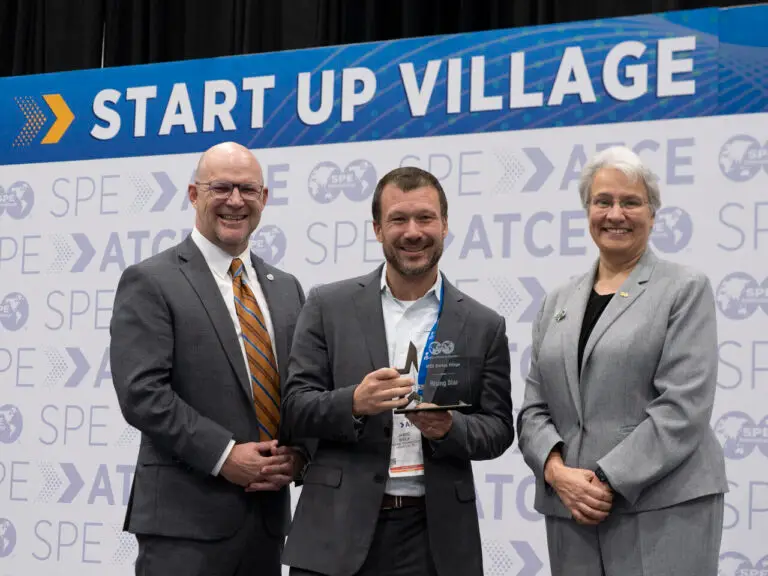Jamie Brick from Daphne Technology receiving award at SPE ATCE 2025 with Bryant Mueller and Jennifer Miskimins.